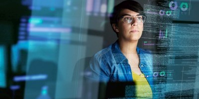 Cropped shot of a young computer programmer looking through data